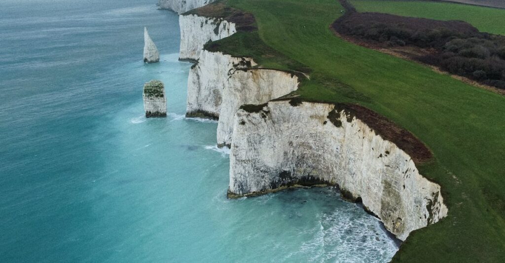 Stunning aerial view of the white chalk cliffs along the UK's southern coastline. Captivating nature scene.
