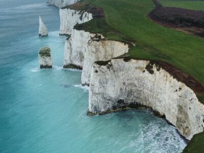 Stunning aerial view of the white chalk cliffs along the UK's southern coastline. Captivating nature scene.